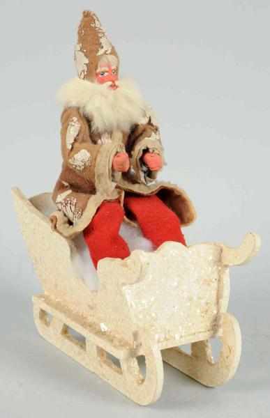 Appraisal: Santa in White Wooden Sleigh Composition face and hands Condition