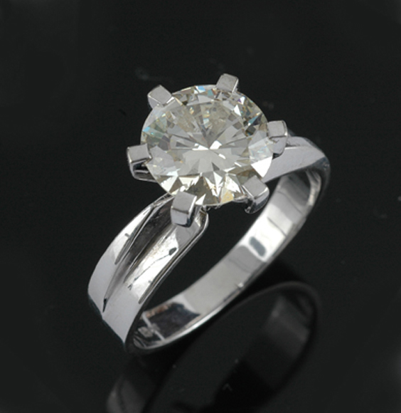 Appraisal: A diamond solitaire ring The round brilliant cut diamond weighing