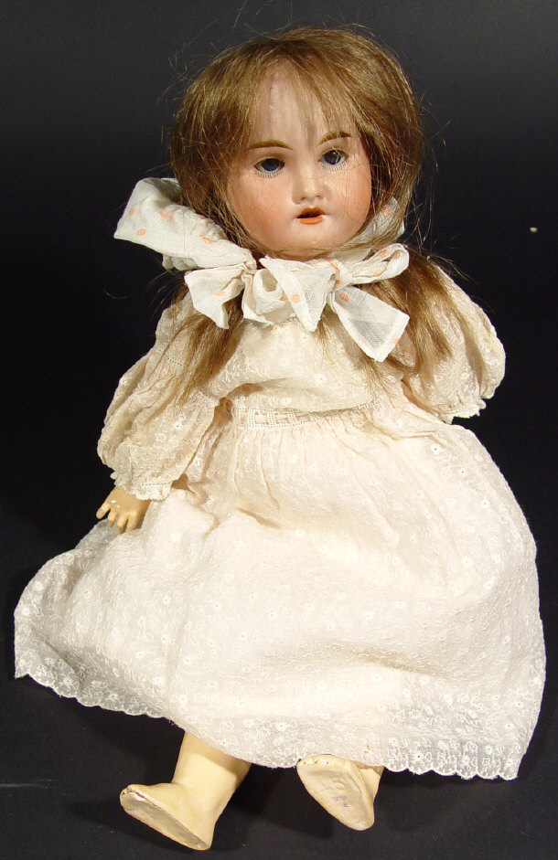 Appraisal: French bisque headed doll with open eyes and open mouth