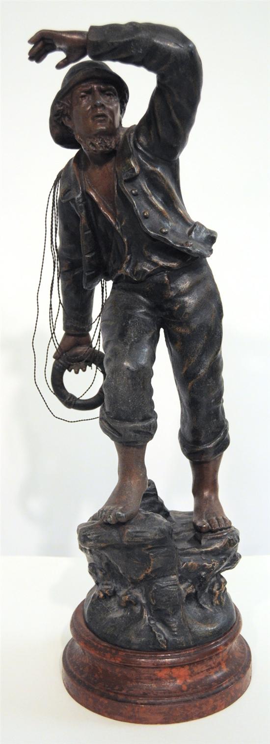 Appraisal: White metal figure titled ''Le Sauveteur'' ''The Rescuer'' cold painted