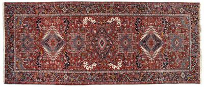 Appraisal: Heriz gallery rug repeating central medallions on brick red field