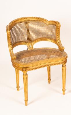 Appraisal: A Louis XVI style salon chair with carved scrolling frame