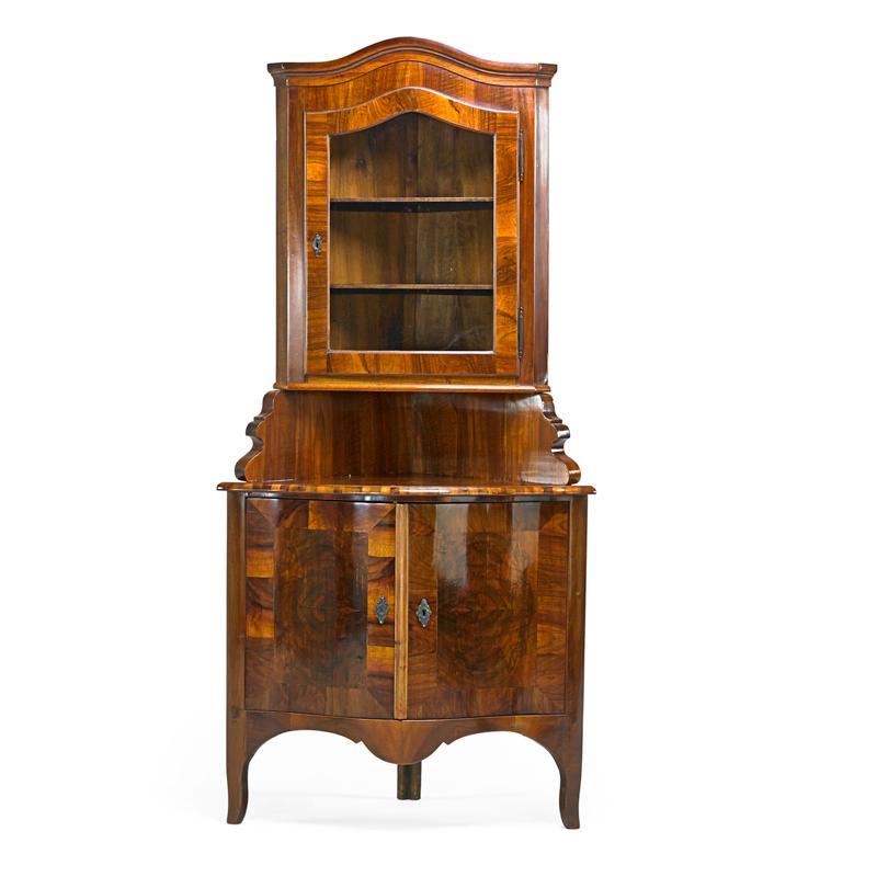 Appraisal: GERMAN BAROQUE STYLE CORNER CABINET Black walnut with single glazed