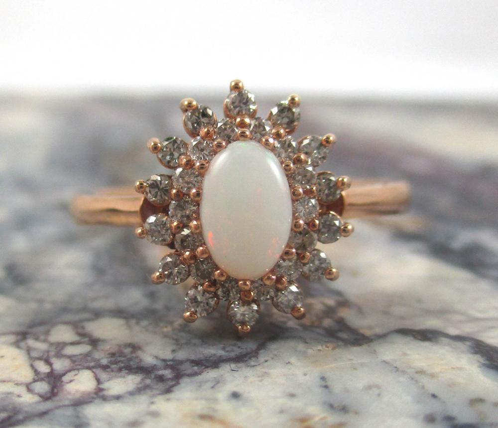 Appraisal: OPAL DIAMOND AND FOURTEEN KARAT GOLD RING The rose gold