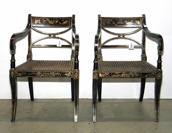 Appraisal: A pair of Regency ebonized and chinoiserie decorated armchairs first