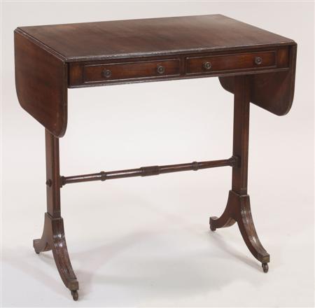 Appraisal: A small Edwardian mahogany sofa table the reeded rounded rectangular