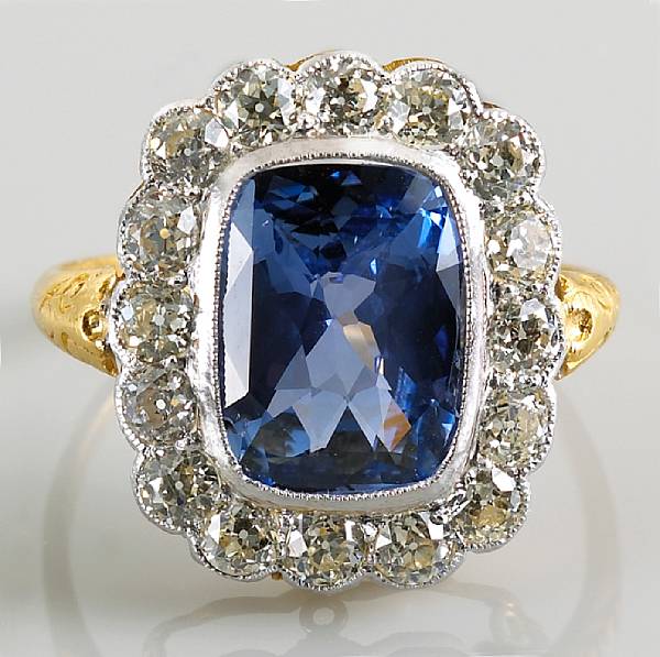 Appraisal: A sapphire and diamond ring cushion-cut sapphire weighing an estimated