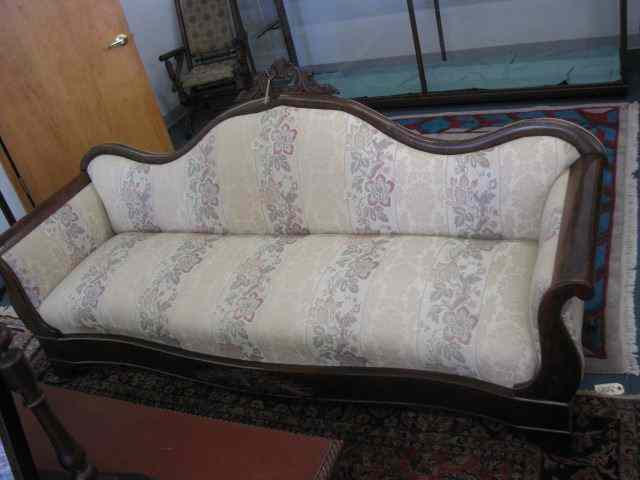 Appraisal: Sofa fine floral brocade fabric on th Century carved back