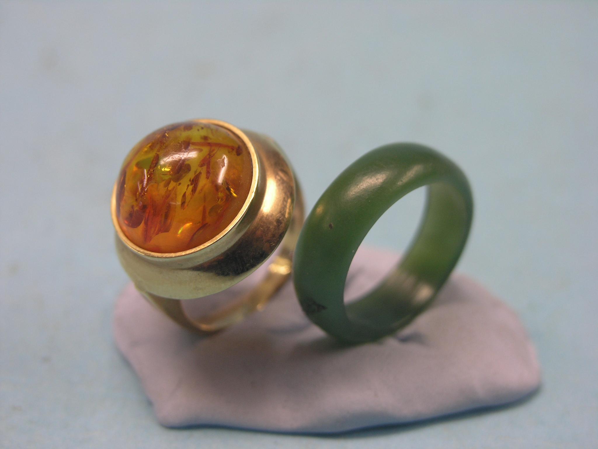 Appraisal: A ct gold and reconstituted amber ring cushion setting size