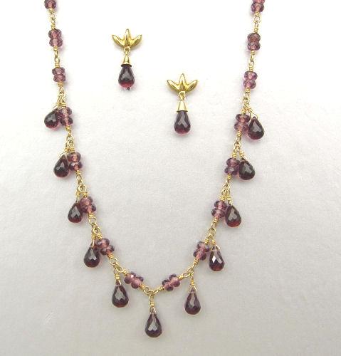 Appraisal: K TIFFANY GARNET NECKLACE EARRING SET K yellow gold and