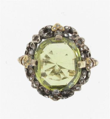 Appraisal: A chrysoberyl and diamond ring The oval shaped chrysoberyl weighs