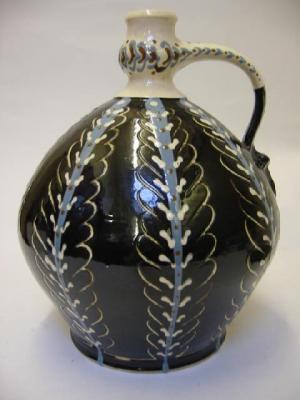 Appraisal: AN AMBLESIDE POTTERY CIDER FLAGON by George F Cook of