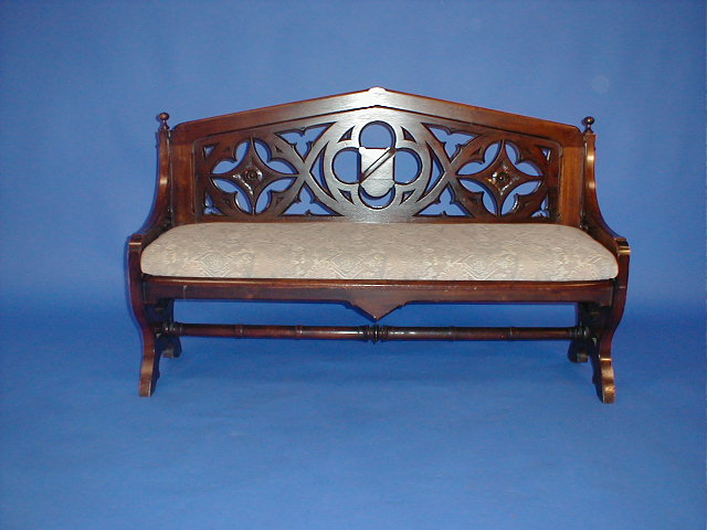 Appraisal: A Victorian mahogany bench seat with pierced and carved gothic