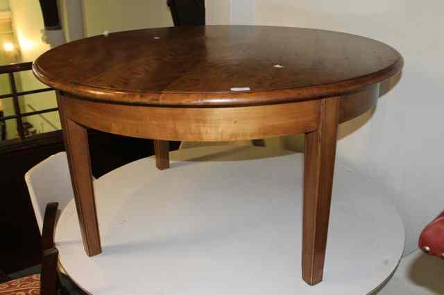 Appraisal: A CONTINENTAL ASH CIRCULAR LARGE COFFEE TABLE diameter