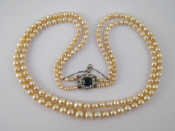 Appraisal: A two row graduated cultured pearl necklace pearls approx -