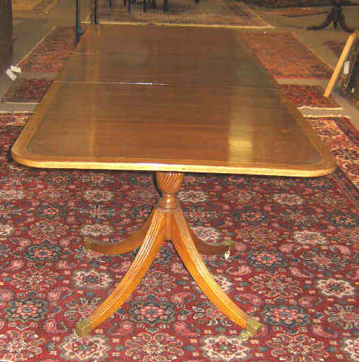 Appraisal: ENGLISH GEORGIAN STYLE MAHOGANY DINING TABLE Rectangular crossbanded top on