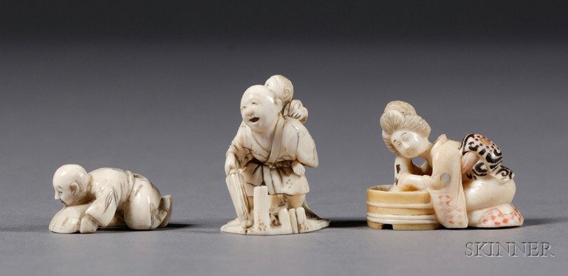 Appraisal: Three Ivory Netsuke th century a man with a child