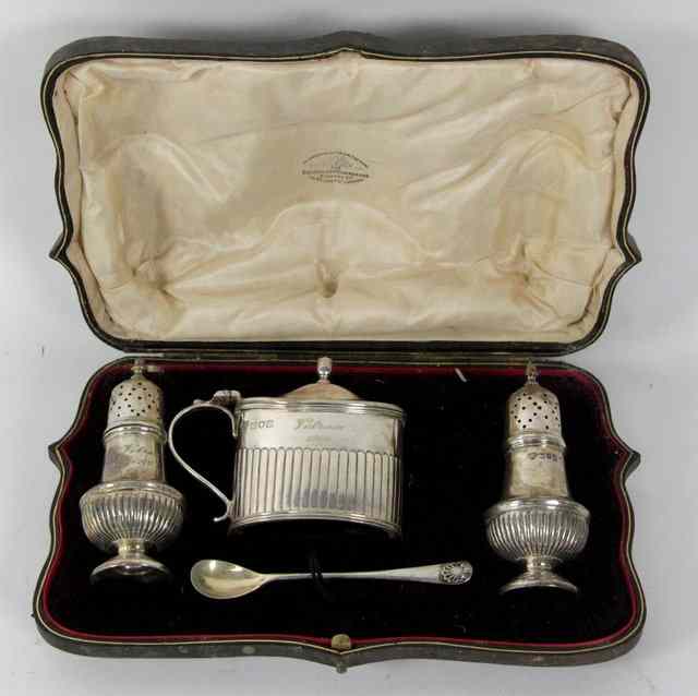 Appraisal: A silver cruet set Goldsmiths Silversmiths Co Ltd London comprising