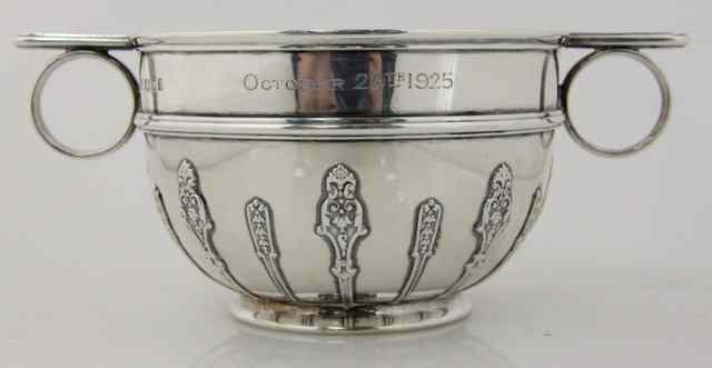 Appraisal: A silver porringer Goldsmiths Silversmiths Co Ltd London with stylized