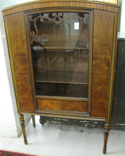 Appraisal: WALNUT AND MAHOGANY CHINA CABINET American c 's The cabinet