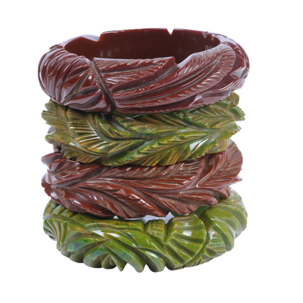 Appraisal: FOUR BAKELITE DEEPLY CARVED BANGLE BRACELETS WITH MARBLED BROWN AND