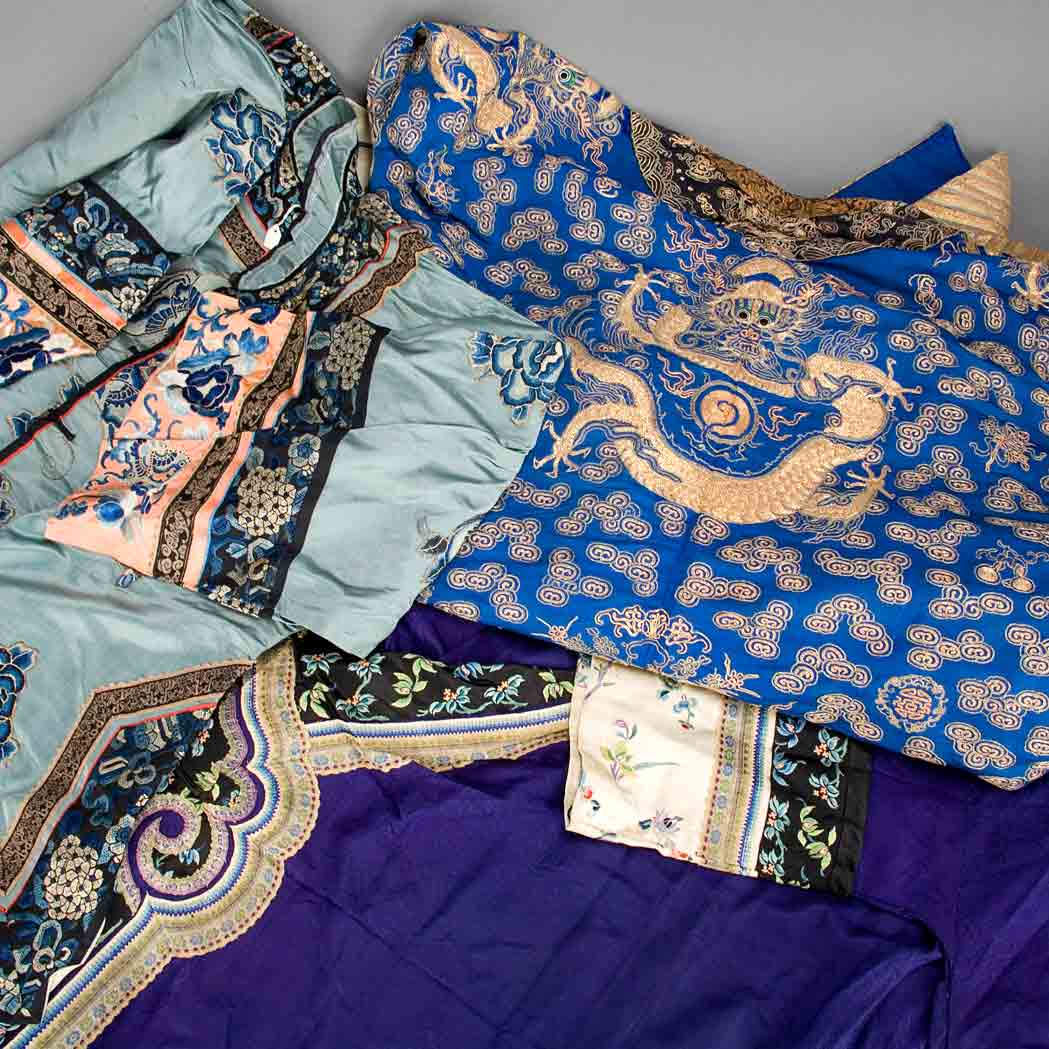 Appraisal: Group of Three Chinese Robes th Century Comprising a purple