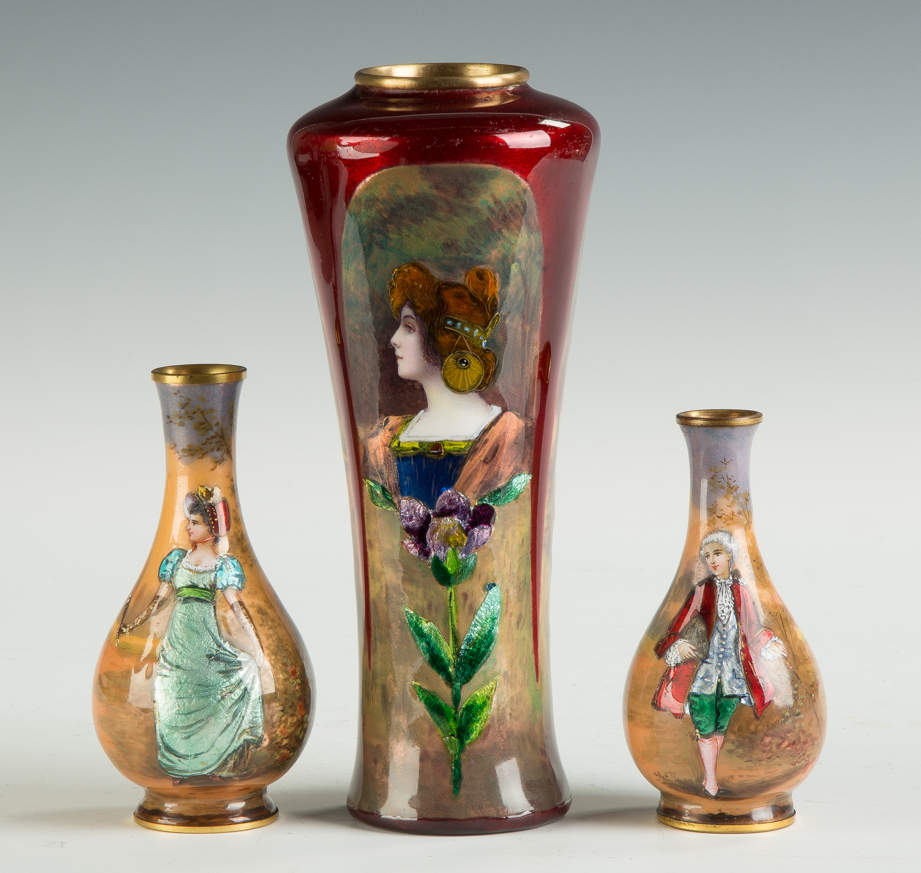 Appraisal: Enameled Vases with Young Beauty in Floral Landscape Background Late