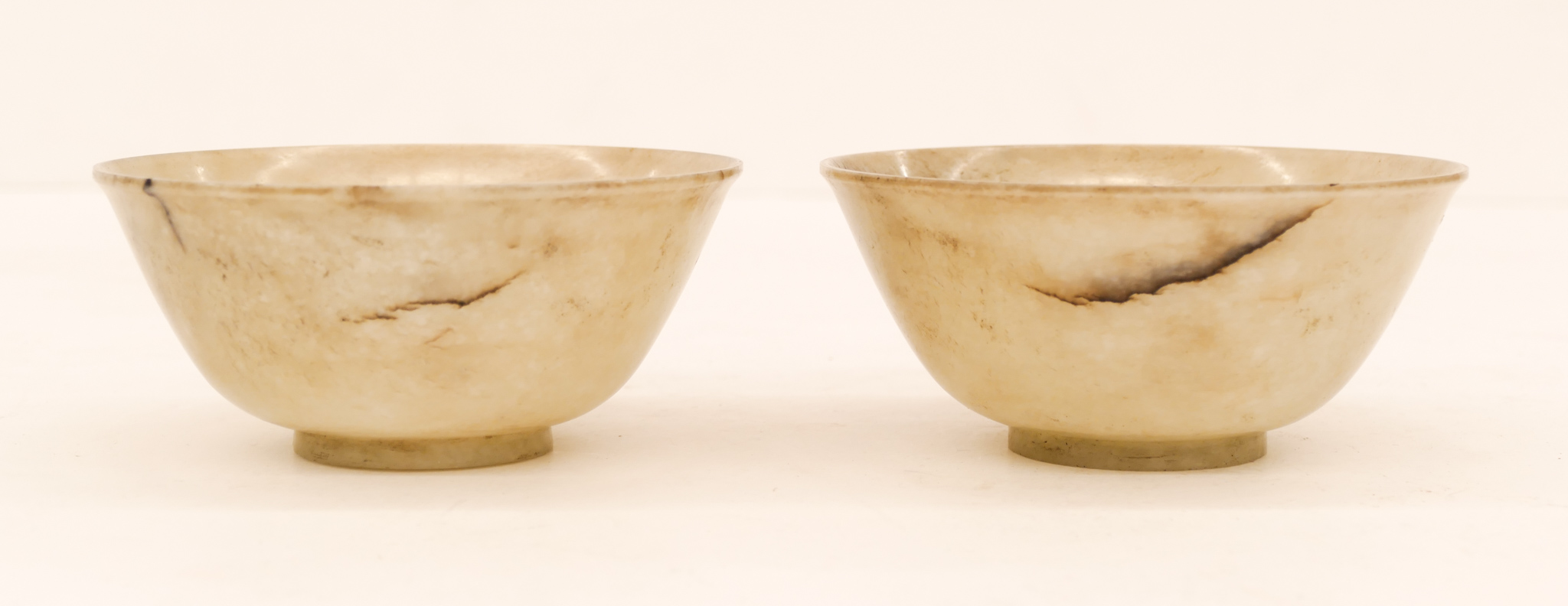 Appraisal: Pair Chinese Qing Jade Tea Bowls ''x '' Matching pair