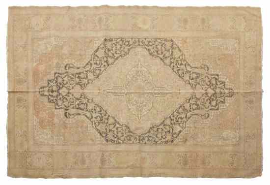 Appraisal: A Turkish Wool Rug having a central ivory lozenge within