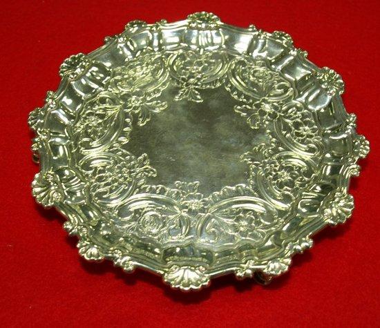 Appraisal: A George II circular waiter with shell and C scroll