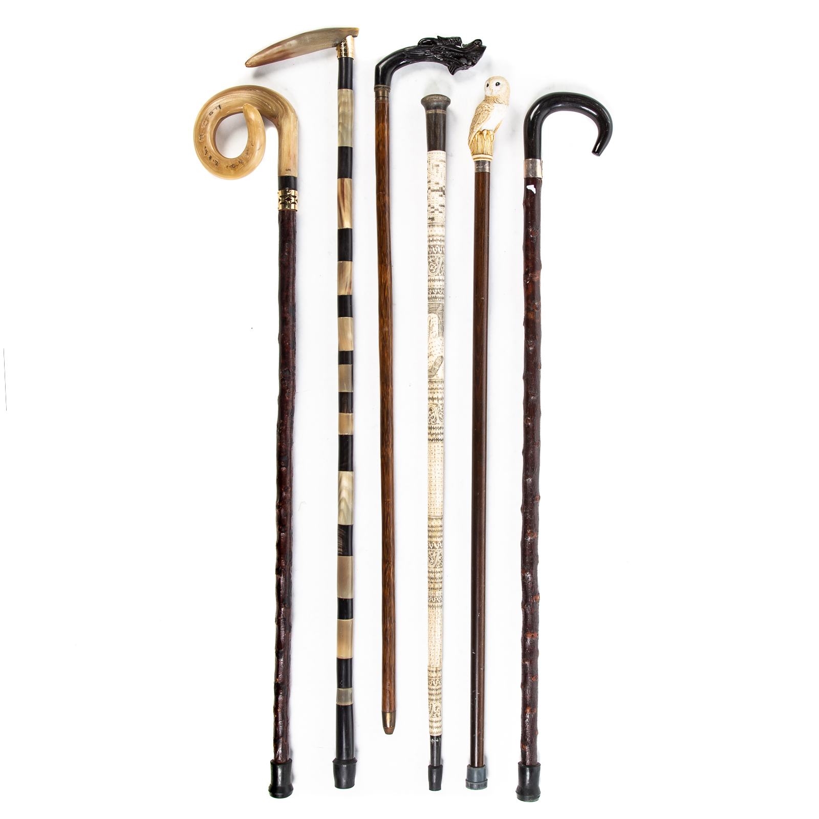 Appraisal: SIX ASSORTED CANES WALKING STICKS Includes walking stick with carved