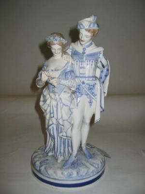 Appraisal: A ROYAL WORCESTER PORCELAIN GROUP of a courting couple modelled