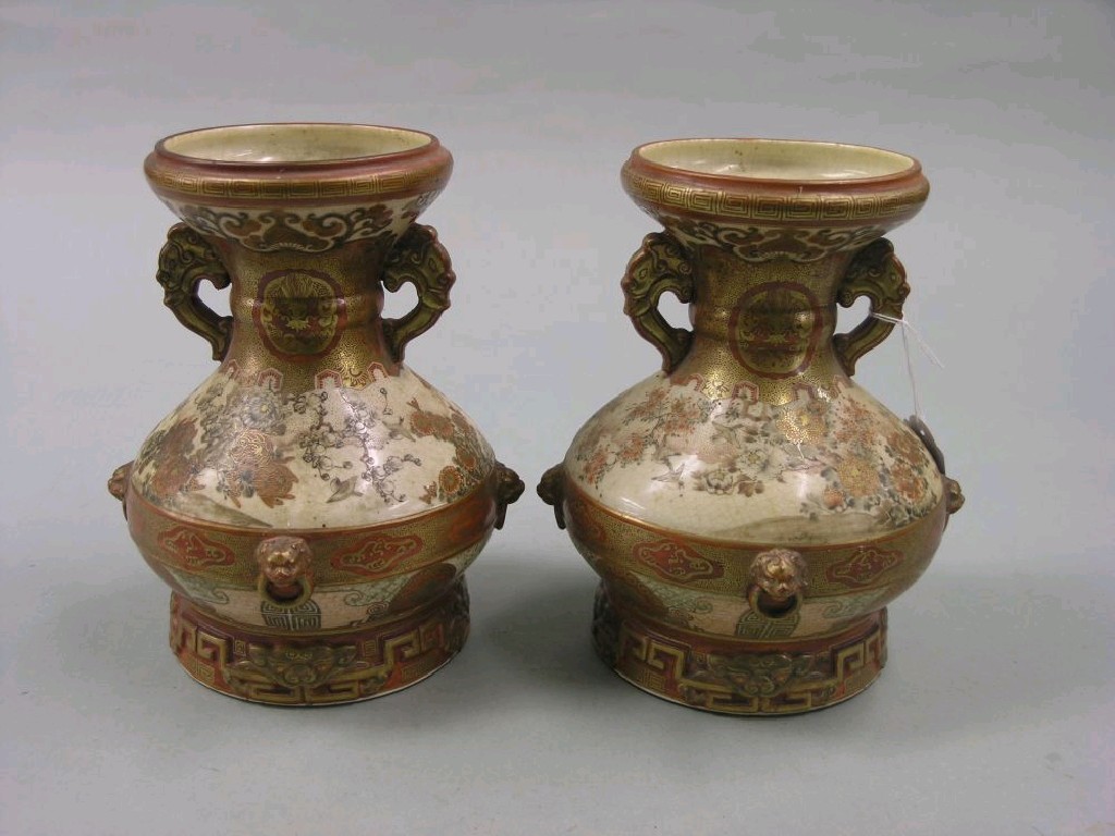 Appraisal: A pair of Kutani vases each bulbous shape with twin