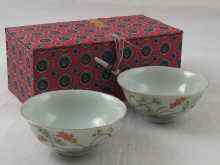 Appraisal: A pair of Chinese tea bowls in protective case overglaze