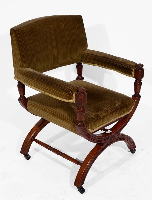 Appraisal: A GILLOWS DESIGN MAHOGANY LIBRARY CHAIR with hoop supports carved