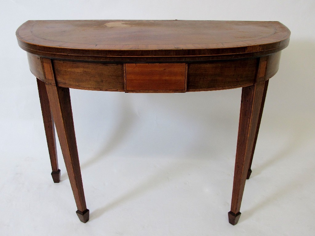 Appraisal: A Georgian demi lune turnover card table the fold over