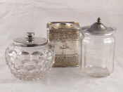 Appraisal: Two moulded glass jam jars with sterling silver lids Sheffield