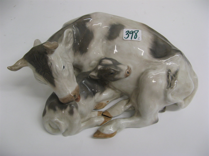 Appraisal: TWO DANISH GLAZED PORCELAIN ANIMAL FIGURES One is a cow