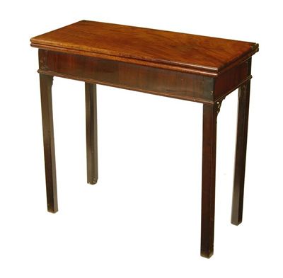 Appraisal: A mahogany tea table the hinged top above a plain