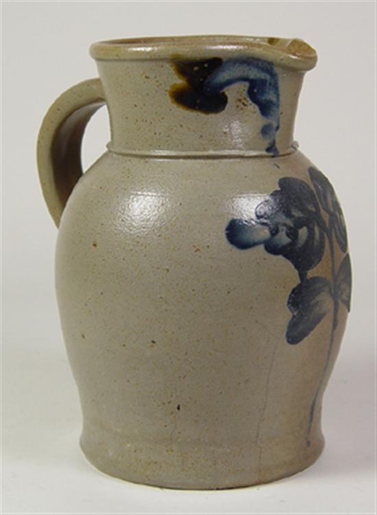 Appraisal: American Stoneware Pitcher Free hand floral decoration repair at rim