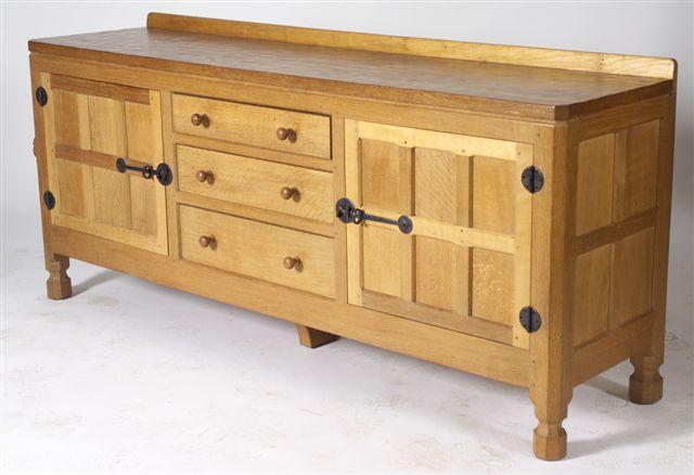 Appraisal: ROBERT MOUSEMAN THOMPSON OAK SIDEBOARD c the adzed top with