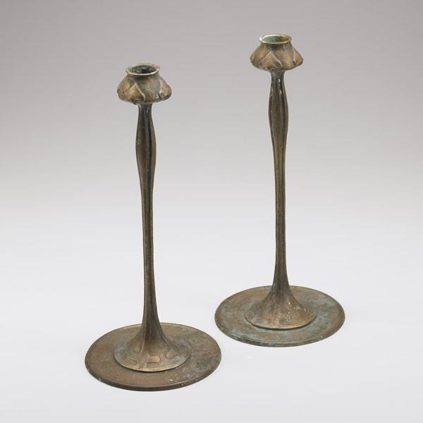 Appraisal: JARVIE Attr Pair of bronze candlesticks embossed with spade-shaped leaves