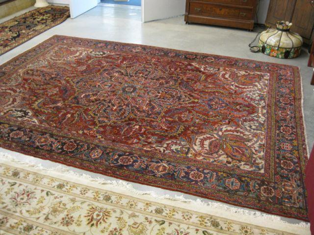 Appraisal: Heriz Persian Handmade Room Size Rug elaborate central medallion geometric