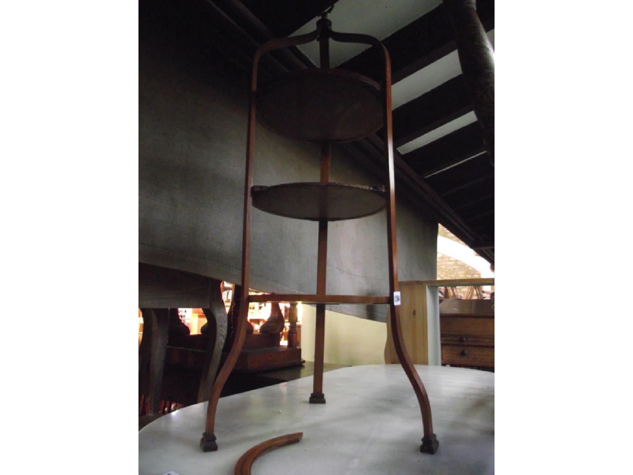 Appraisal: An Edwardian satinwood three tier cake stand each circular tray