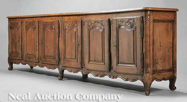 Appraisal: An Antique French Provincial Carved Oak Enfilade the molded top