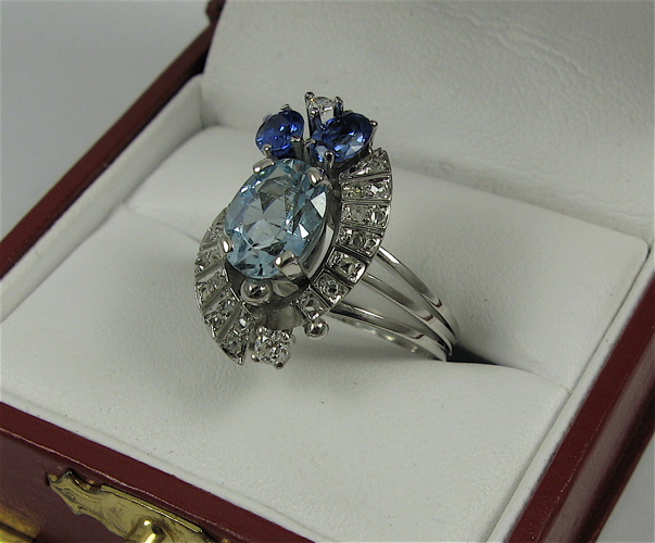 Appraisal: AQUA SAPPHIRE DIAMOND AND PLATINUM RING set with an oval-cut