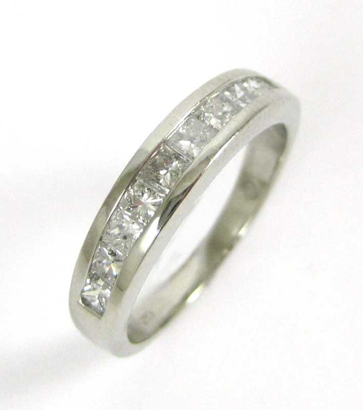 Appraisal: DIAMOND AND PLATINUM RING channel set with a row of