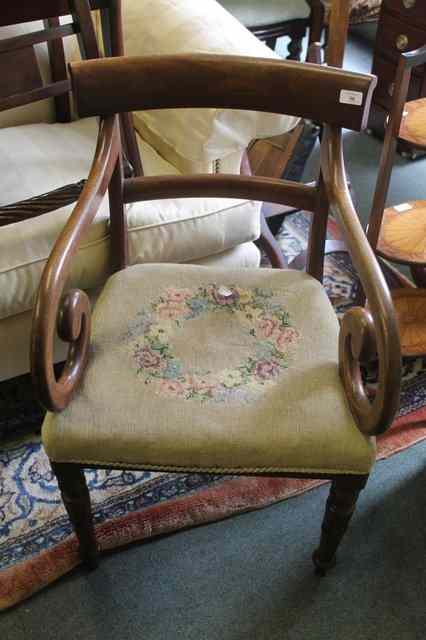 Appraisal: A REGENCY MAHOGANY CARVER CHAIR with scroll arms and on