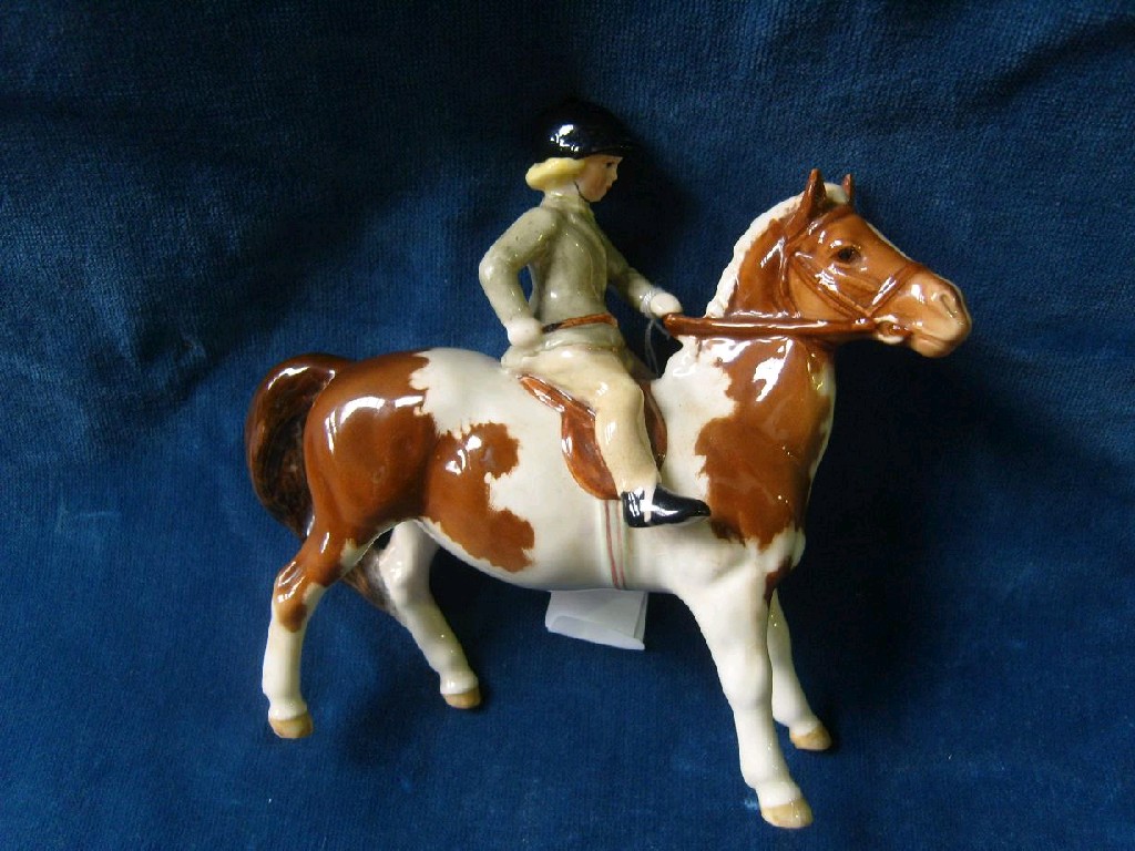 Appraisal: A Beswick figure of a girl on a pony with