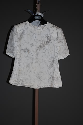 Appraisal: Andr Laug short sleeve tan silk blouse with floral print